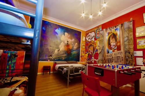 a room with a bunk bed and a play table at Comics Guesthouse Hostel in Rome