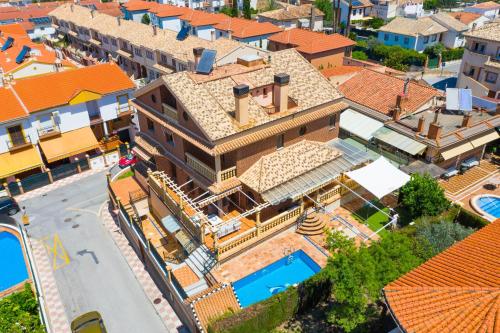 an aerial view of a house with a swimming pool at Villa Luis R in Cájar