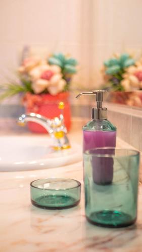 a bathroom sink with a soap dispenser on a counter at Villa Luis R in Cájar