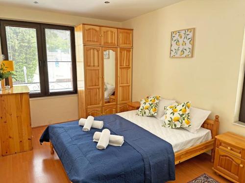 a bedroom with a bed with two crosses on it at Beachside Bliss by Mery -Balchik in Balchik