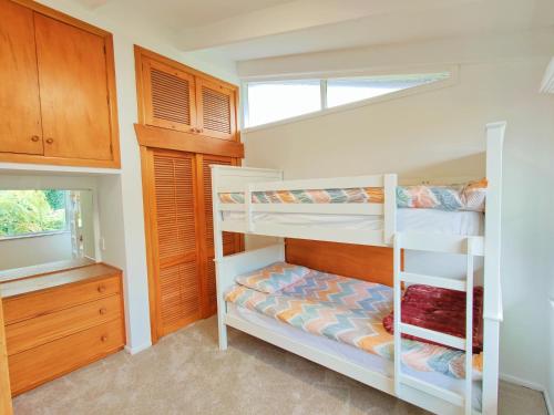 a bunk bed room with two bunk beds in it at Delight in Birch-Lake View Holiday Home in Taupo