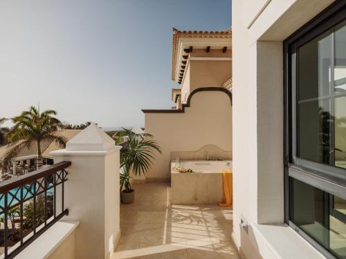 a balcony of a house with a bath tub at Red Level at Gran Melia Palacio de Isora - Adults Only in Alcalá