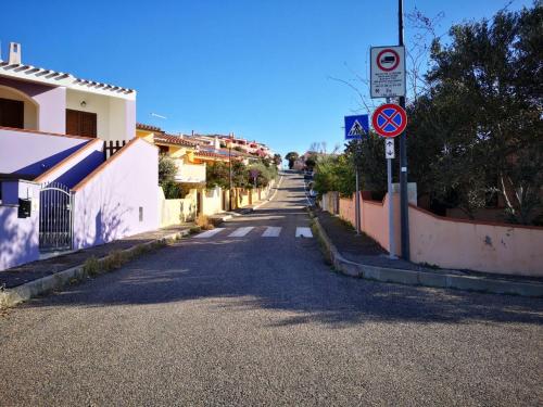 an empty street in a village with a no parking sign at Funtana Meiga, il tuo angolo di paradiso in Funtana Meiga