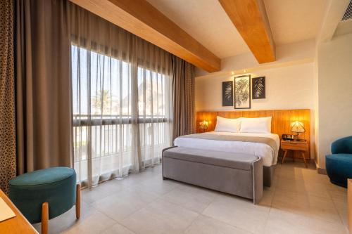 Кровать или кровати в номере Al Masa Hotel El Sokhna
