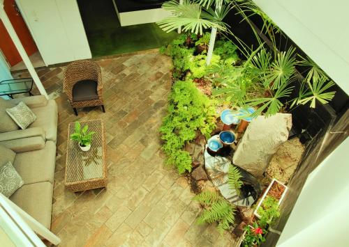 an overhead view of a garden with a couch and a table at Delight in Birch-Lake View Holiday Home in Taupo