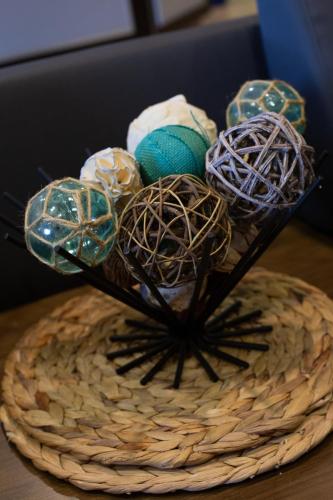 a basket with yarn and knitting needles on a table at Microtel Inn & Suites by Wyndham Waynesburg in Waynesburg