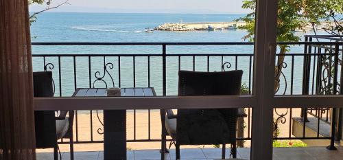 a view of the ocean from a balcony at Apartment Porto Chernomoretz in Chernomorets