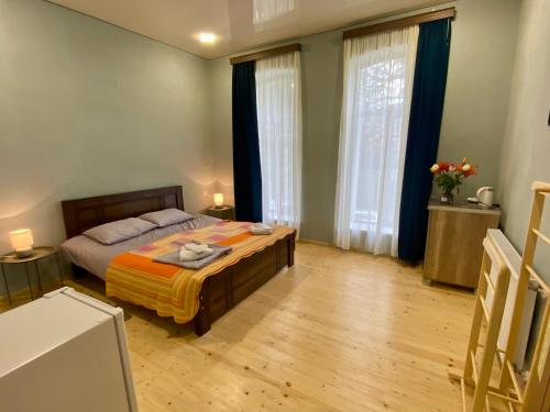 Katil atau katil-katil dalam bilik di Moedani-Very Center Apartments in Kutaisi