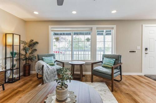 a living room with two chairs and a table at Park and Mountain View, near Downtown Everett, Boeing in Everett