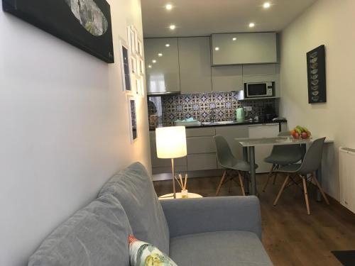 a living room with a couch and a table at Povoa do Mar in Póvoa de Varzim