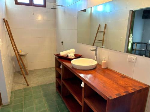 a bathroom with a sink and a mirror at Hotel La Polvora in Granada