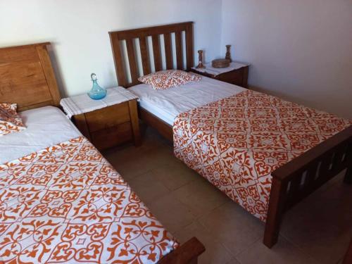 two beds sitting next to each other in a room at Ivi's House Giolou in Paphos City