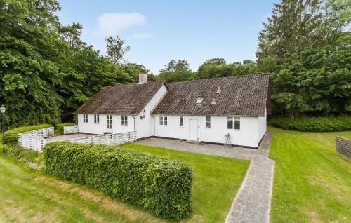 a white house with a large yard at Lejl, 4 in Brovst