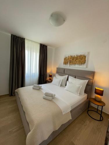 Postel nebo postele na pokoji v ubytování Apartments Lace