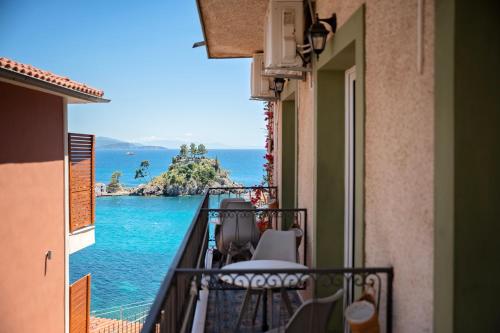 a balcony with a view of the ocean at Avra in Parga