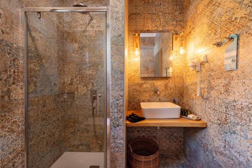a bathroom with a shower and a sink at Avra in Parga
