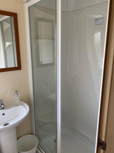 a bathroom with a shower and a sink at 29 Morningside at Southview in Skegness - Park Dean resorts in Lincolnshire