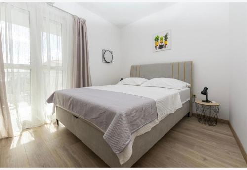 Posteľ alebo postele v izbe v ubytovaní Apartments Vulić