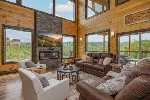 a living room with couches and a fireplace at Peace Giver by Eden Crest in Gatlinburg