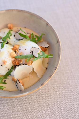 a bowl of food on a table at Hôtel Bor in Hyères