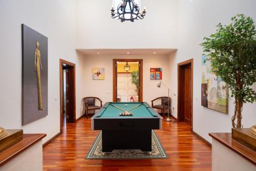 a living room with a pool table in it at Finca del Moral in Tinajo