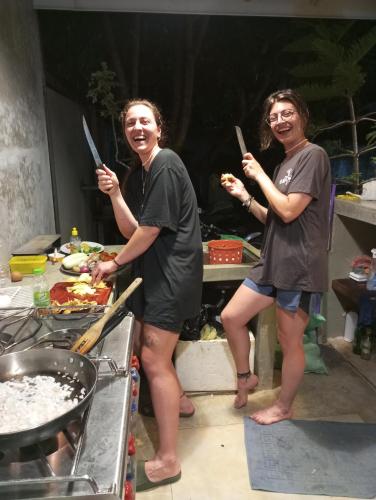 two people standing in a kitchen holding knives at Nade Villas Ahungalla in Ahungalla