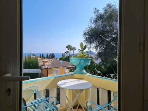 a view from a balcony with a table and chairs at Feet in Water Vila at Saint Jean Cap Ferrat in Saint-Jean-Cap-Ferrat