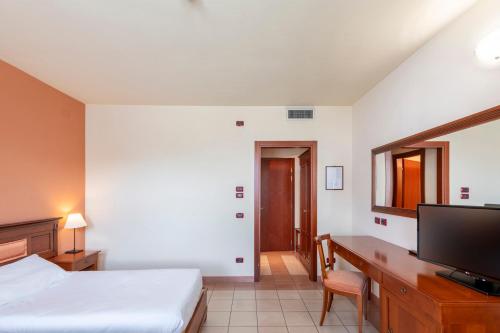 Una cama o camas en una habitación de Hotel Vecchio Casello