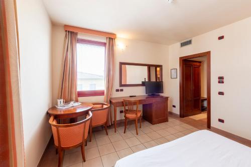 Una cama o camas en una habitación de Hotel Vecchio Casello
