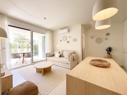 a living room with a couch and a table at Forte House T2 by Portugal Hideaway in Tavira