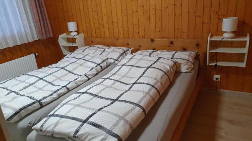 Postel nebo postele na pokoji v ubytování Chalet Falk
