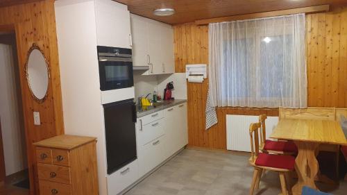 Kuchyň nebo kuchyňský kout v ubytování Chalet Falk