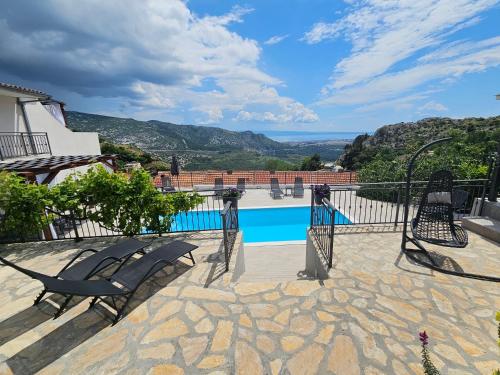 a view of the pool from a house at Holiday House Above with pool and summer kitchen in Klis