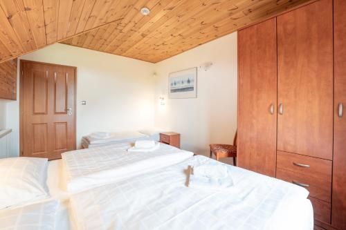 Postel nebo postele na pokoji v ubytování EA Apartmány na Filipce