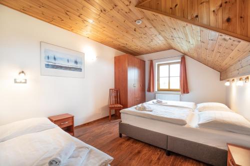 Postel nebo postele na pokoji v ubytování EA Apartmány na Filipce