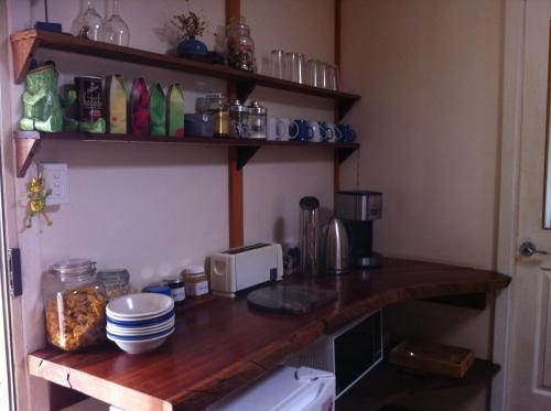 a kitchen with a counter top with a microwave at Windrose B&B in Denmark