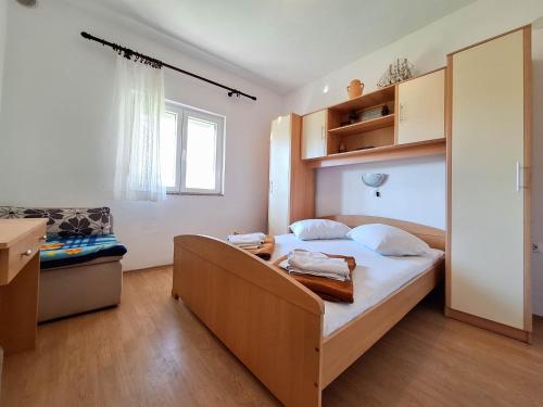 Ένα ή περισσότερα κρεβάτια σε δωμάτιο στο Apartments Mirko R