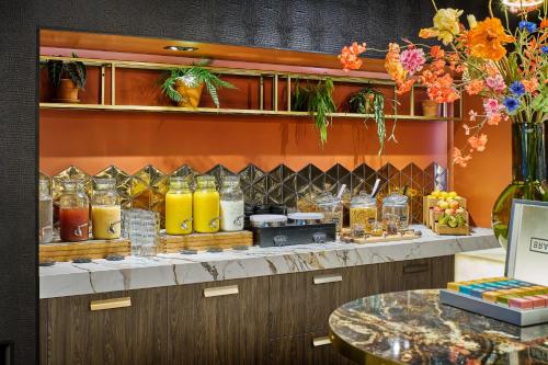 a kitchen with a counter with drinks on it at Hotel Restaurant Grandcafé 't Voorhuys in Emmeloord
