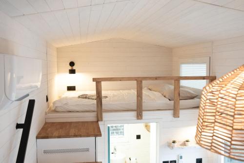 Postel nebo postele na pokoji v ubytování Tiny House Le Poulailler