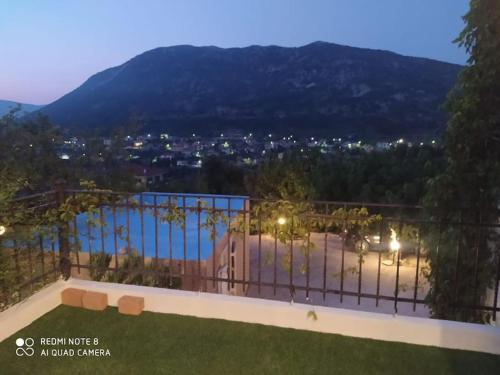 a view of a city from the balcony of a house at Villa in idyllic quiet nature in Benettáta