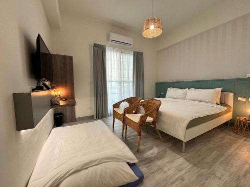 Postel nebo postele na pokoji v ubytování WinXin House