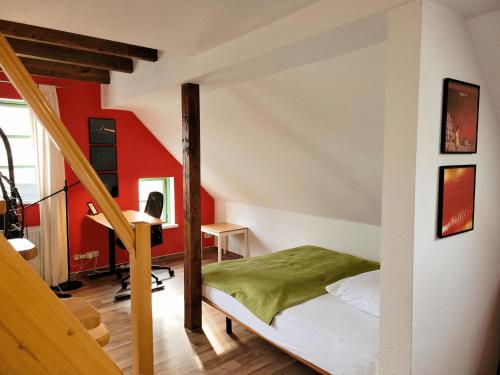 a bedroom with a bunk bed and a staircase at Marktstübchen in Waren
