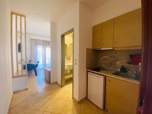 a kitchen with a sink and a counter at Summer Dreams Studios in Skala Potamias