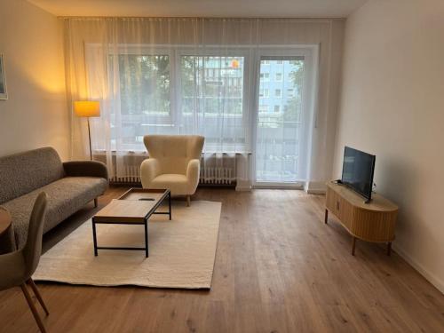 TV a/nebo společenská místnost v ubytování Zentrale Wohnung in Düsseldorf nahe Messe & Rhein