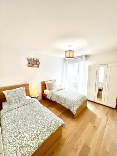 Postel nebo postele na pokoji v ubytování Appartement neuf et spacieux