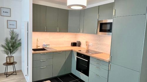 Kuchyň nebo kuchyňský kout v ubytování Appartement neuf et spacieux