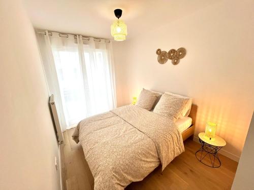 Postel nebo postele na pokoji v ubytování Appartement neuf et spacieux