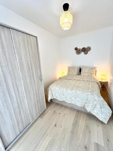 Postel nebo postele na pokoji v ubytování Appartement neuf et spacieux