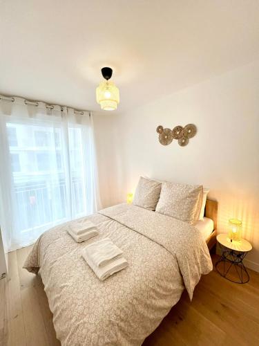 Postel nebo postele na pokoji v ubytování Appartement neuf et spacieux