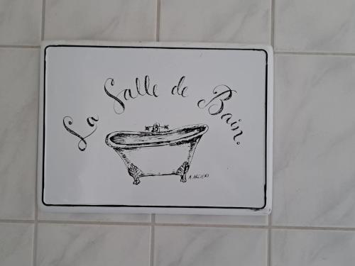 a sign on a bathroom wall with a drawing of a bathtub at Haus Eufalia in Blankenheim
